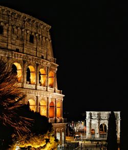 Low angle view of historical building against sky at night