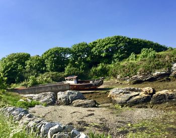 Scenic view of rocks against clear sky