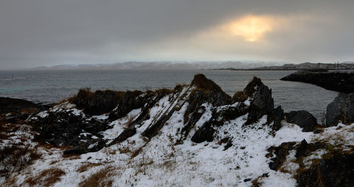 Scenic view of sea against sky during winter
