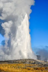 Old faithful geyser in upper geyser basin at yellowstone national park