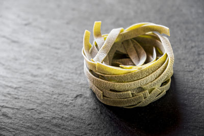 Close-up of raw tagliatelle on table