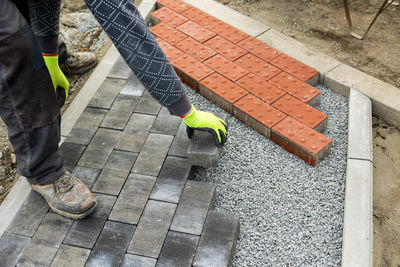 Low section of man walking on footpath
