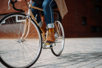 Close up leg shot of man riding bicycle. eco transport. modern