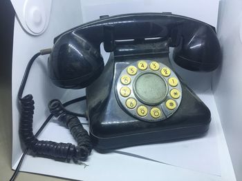 High angle view of telephone on table