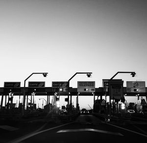 Cars on road against clear sky