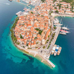 High angle view of canal amidst buildings in city