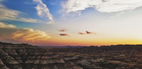 Scenic view of landscape against sky during sunset