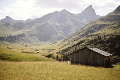 Scenic view of landscape and mountains against sky