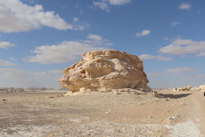 Rock formations in desert against sky