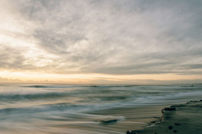 Scenic view of calm sea at sunset