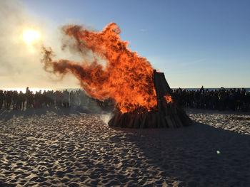 Panoramic view of fire on beach