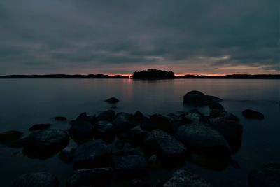 Scenic view of sea against sky at sunset