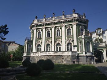 Facade of historic building against clear blue sky