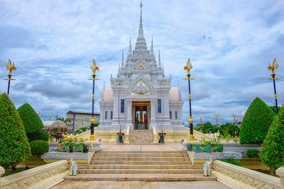 Buddhist temple against cloudy sky