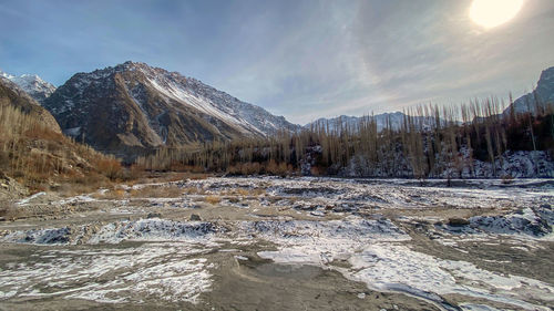 Scenic view of snowcapped mountains against sky