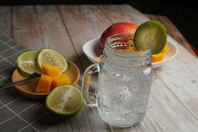 Fruits in glass on table