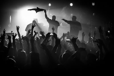 Silhouette crowd enjoying concert rock band