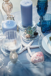 Close-up of plant and blackberry in plate on table