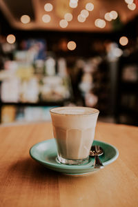 Close-up of coffee served on table at cafe