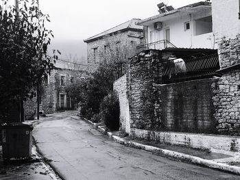 Road amidst houses in town