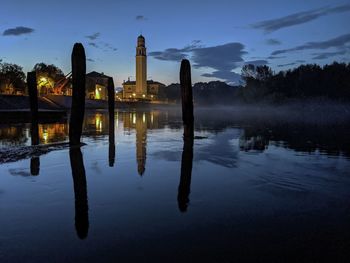 Scenic view of lake against sky at sunset