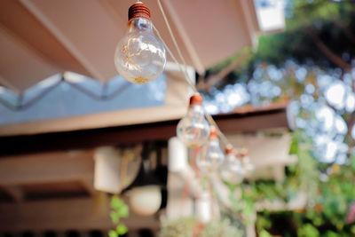 Low angle view of light bulb on table