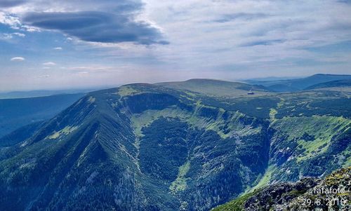 Aerial view of landscape against cloudy sky