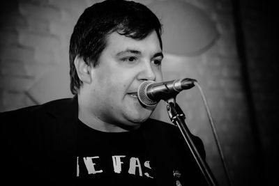 Close-up of young man singing