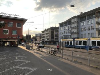 City street and buildings against sky