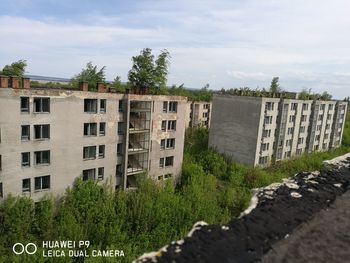 Buildings in city against sky