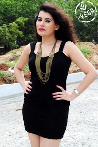 Portrait of beautiful woman standing in park