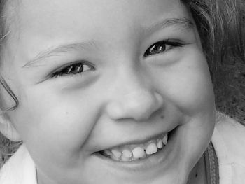 Close-up portrait of cute girl smiling