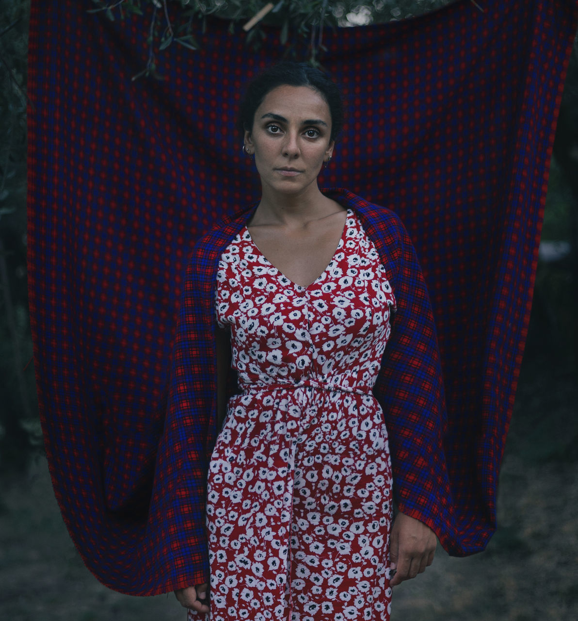 one person, fashion, women, portrait, spring, adult, pattern, dress, clothing, looking at camera, young adult, front view, standing, three quarter length, blue, female, arts culture and entertainment, serious, red, purple, nature, lifestyles, gown
