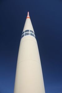 Low angle view of lighthouse against clear blue sky