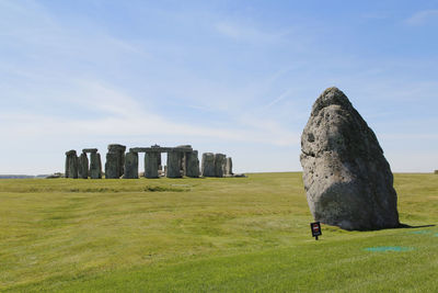 Old ruins on field against sky