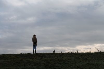 Man photographing against sky