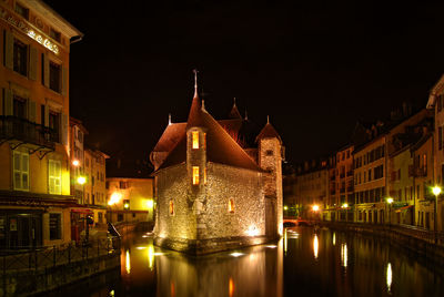 Reflection of illuminated buildings in water