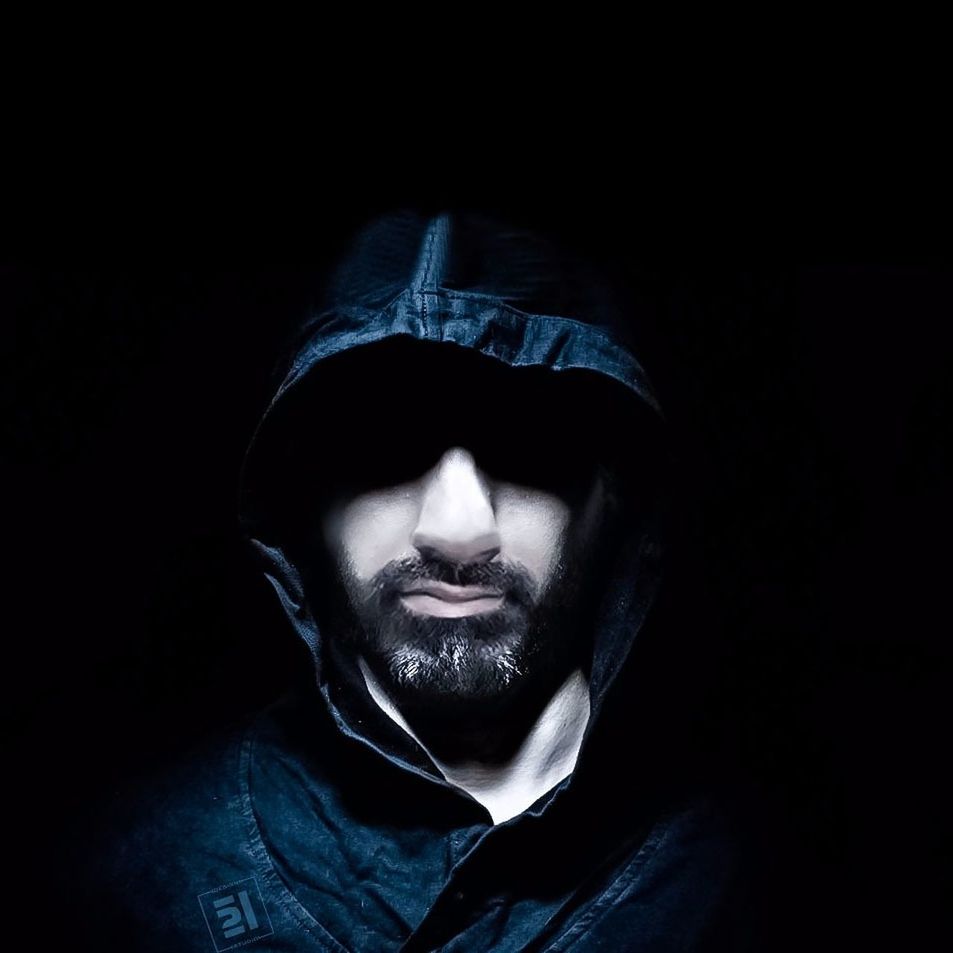 one young man only, only men, black background, studio shot, one man only, young men, one person, young adult, adults only, men, portrait, people, evil, beard, adult, males, real people, close-up, baseball cap, indoors, night, macho