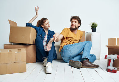 Young couple sitting in box