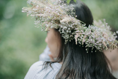 Portrait of woman with pink flowers