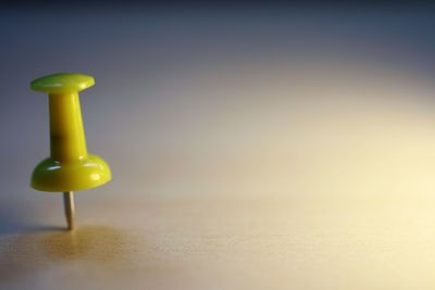 Close-up of yellow toy on table