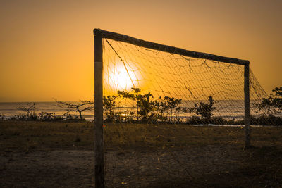 Scenic view of field against sky during sunset