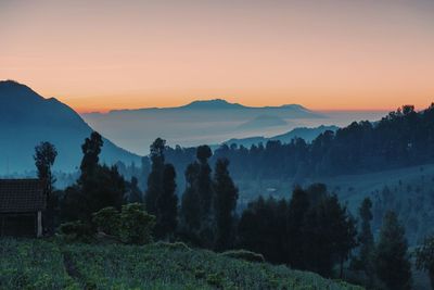 Scenic view of mountains against sky during sunset