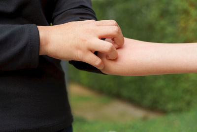 Close-up of man holding hands