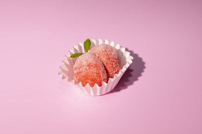 Close-up of dessert against pink background