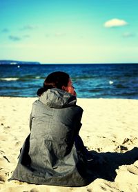 Rear view of man on beach
