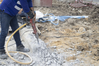 Low section of man working at construction site