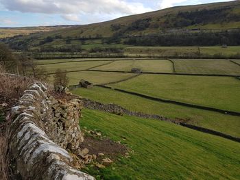 Scenic view of farm against sky