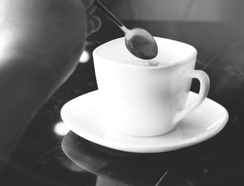 Close-up of coffee cup on table