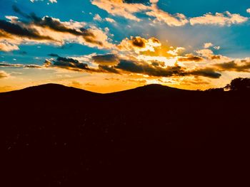 Scenic view of silhouette landscape against sky during sunset